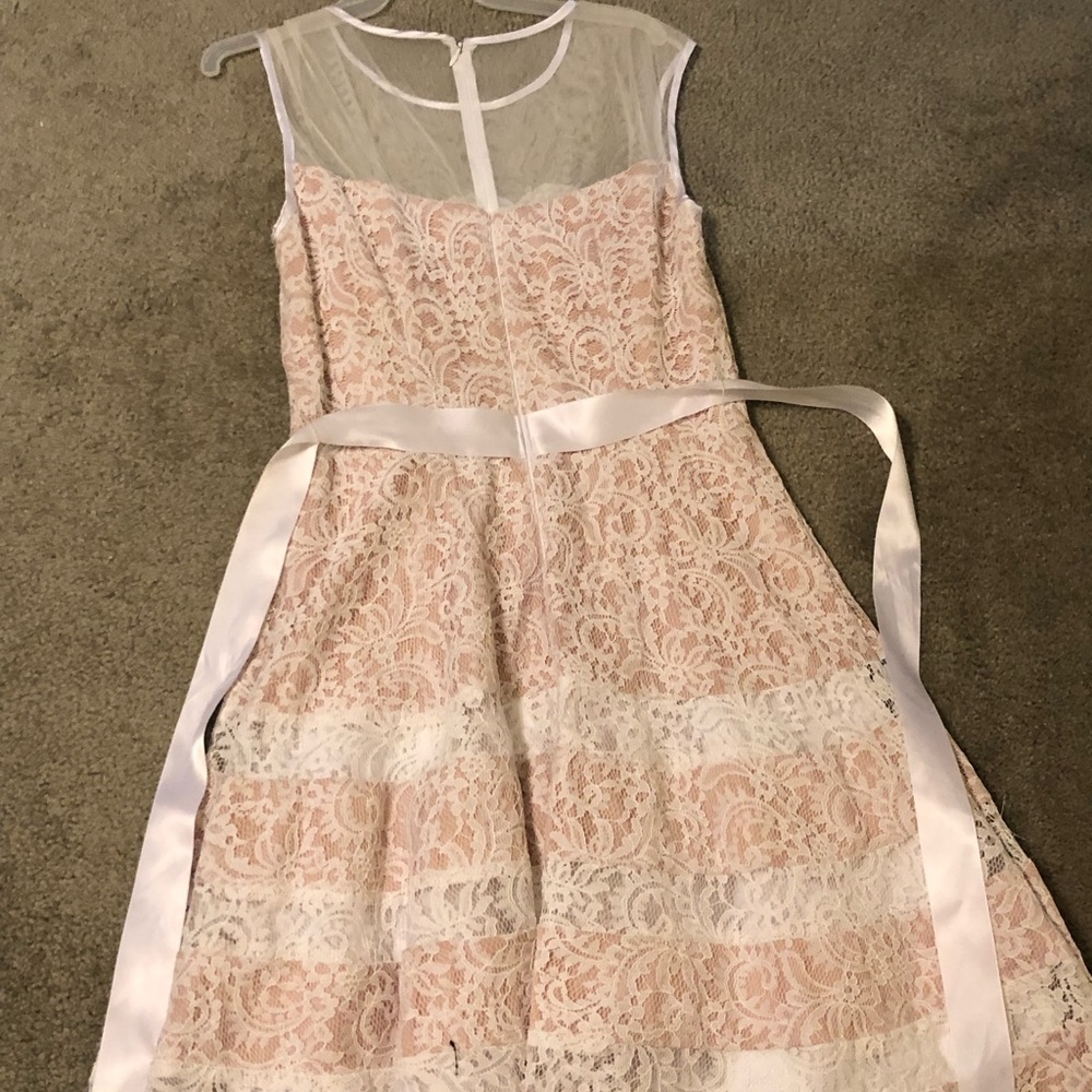 Woman’s Lace Fit & Flare party dress with belt.